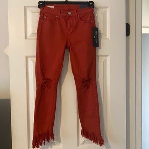 Rust colored True Religion jeans